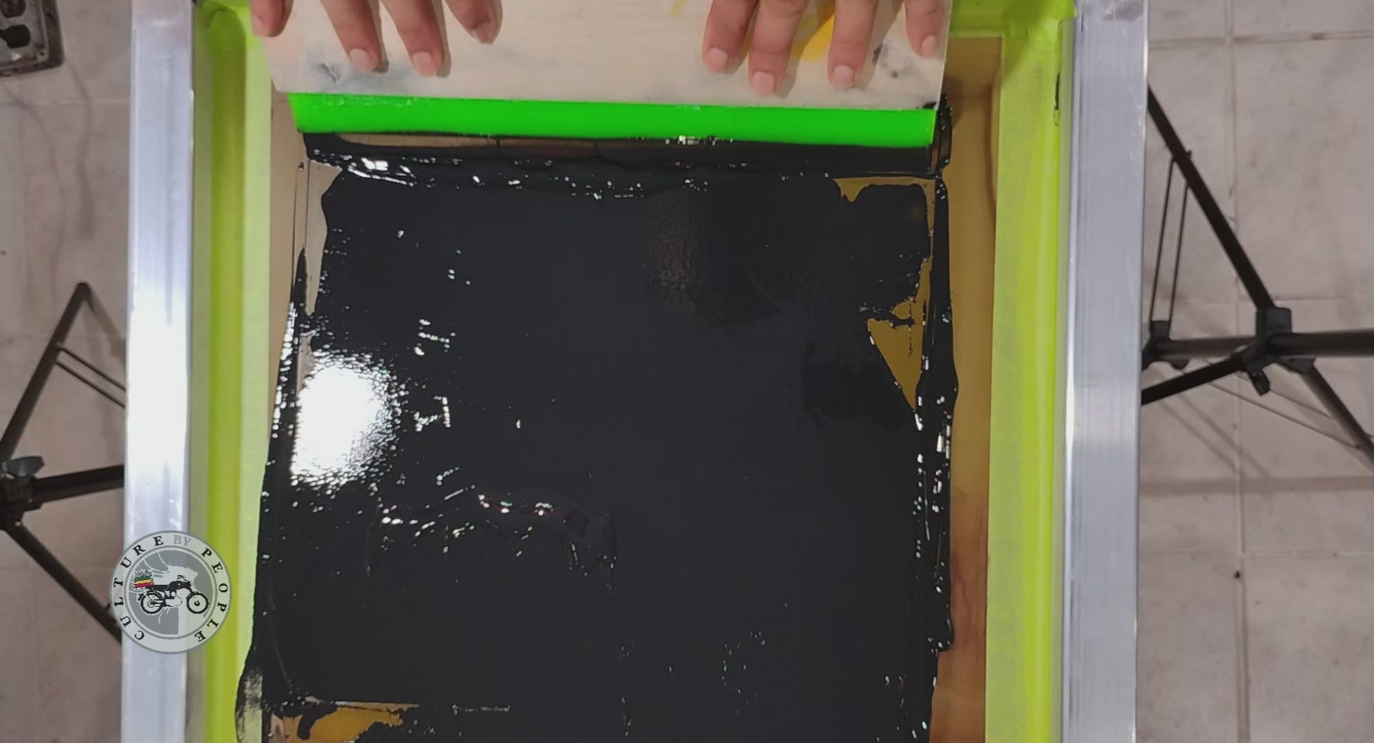 Load video: Joel Williams hand screen printing apparel for Culture by People.